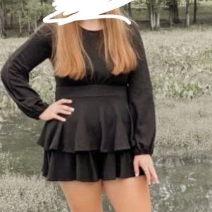 Size medium black romper to dress up in.